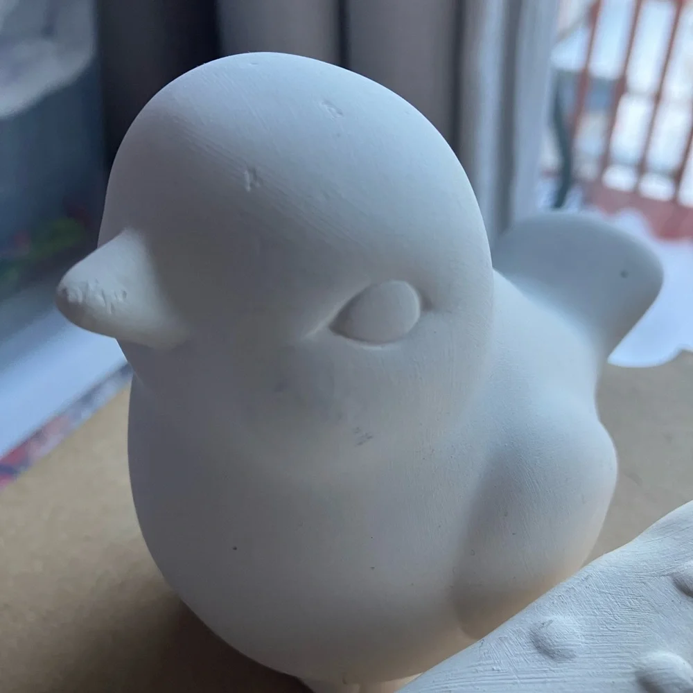 Unpainted bisque ceramic unfinished bird and strawberry cake figurines pottery